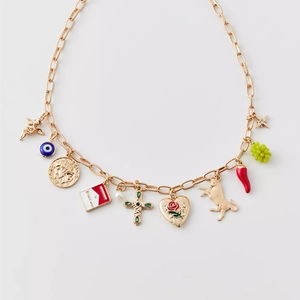 Vintage gold-plated charm necklace featuring eclectic western motifs and enamel icons