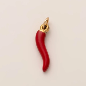 Detailed close-up of a red enamel chili cornuto pendant with 18K gold plated loop