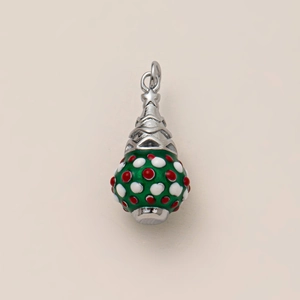 Detail of Christmas tree pendant with green enamel and festive red and white dots