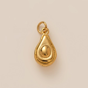 Detailed view of a golden avocado pendant with a polished metallic finish for jewelry