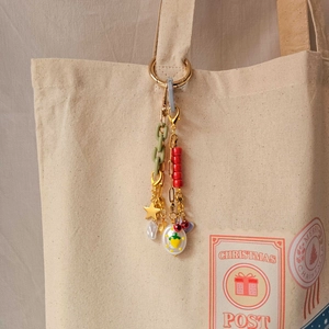 DIY charm keychain with green resin chain and red cherry pendants for bags