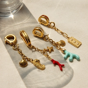 Detailed macro view of 18K gold plated sea life pendants with colorful enamel and zircons
