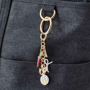 DIY 18K gold plated keychain featuring enamel chili, bow, and citrus slice charms