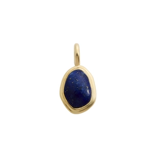 Macro detail of natural lapis lazuli pendant with 18K gold plated irregular metal frame