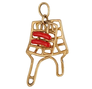 Detailed close-up of a 18K gold-plated stainless steel BBQ grill pendant with red enamel