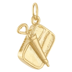Macro shot of 18K gold plated fountain pen and clipboard charm for jewelry DIY