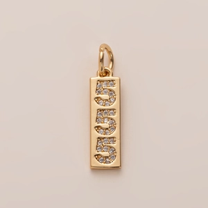 Macro shot of 18K gold-plated vertical pendant featuring triple number 5 in pavé zircons