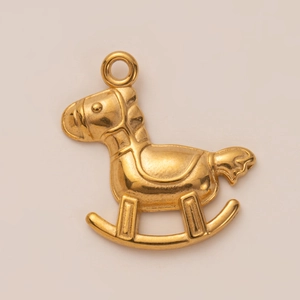 Detail of 18K gold plated rocking horse pendant with polished finish and embossed texture