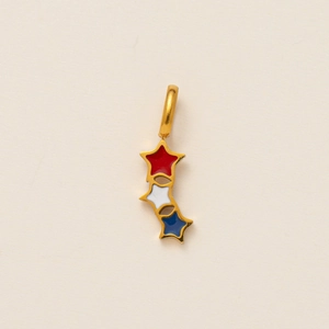 Detail of a 18K gold plated celestial star pendant with red, white and blue enamel inlay