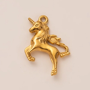 Detailed close-up of 18K gold plated stainless steel unicorn charm for DIY jewelry