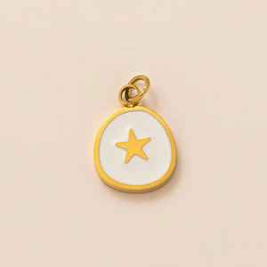 Detail of 18K gold-plated oval pendant with white enamel and golden star charm