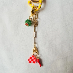 Detail of DIY keychain with 18K gold-plated chain, cactus bead, heart and chili charms