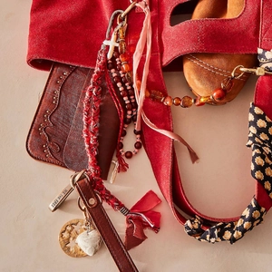 Bohemian bordeaux suede handbag with mixed beaded charms and metal star pendants