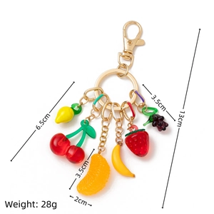 Keyring detail featuring six colorful fruit charms with size and weight annotations