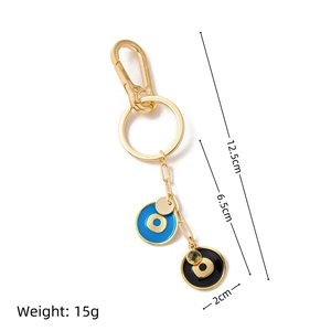 Détail du bijou de sac œil bleu plaqué or 18K avec pendentif émaillé et dimensions