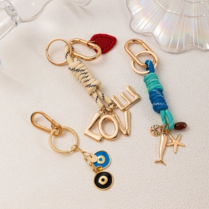Charme de Sac à la Mode en Alliage de Zinc Porte-Clés Avec Pendentif Mauvais Œil Cœur Étoile de Mer Corde Tressée Accessoires de Sac DIY Bijoux Pour Femmes