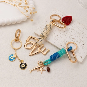 Bijoux de sac dorés 18K avec cœur, lettres d'amour et pendentifs contre le mauvais œil