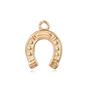 Macro detail of 18K gold plated horseshoe pendant with embossed texture and metal ring