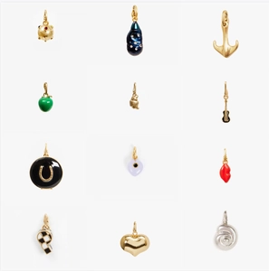 Detailed collection of twelve trendy gold-plated charms including anchors and hearts