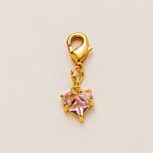 Pink heart-shaped crystal pendant with gold lobster clasp and four-prong setting