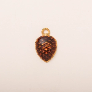 Detail of pinecone pendant with amber brown resin scales and golden metal clasp