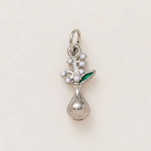 Detail of flower vase pendant with white enamel lily of the valley and green leaves