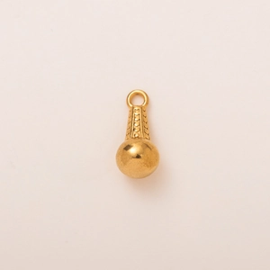 Macro shot of 18K gold plated spherical charm with textured dotted details and loop