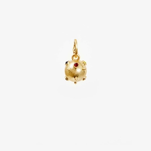 Detail of a spherical gold pendant with colorful inlaid gemstones on a white background