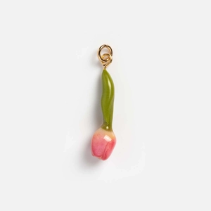 Macro shot of tulip-shaped pendant with pink enamel petals and 18K gold jump ring