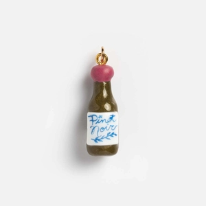 Detailed close-up of a Pinot Noir wine bottle pendant with 18K gold plated loop