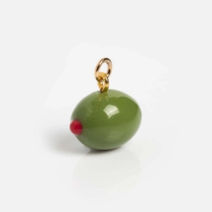 Macro detail of a 18K gold-plated olive charm with green enamel and a red pepper heart