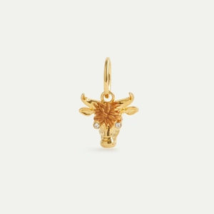 Detailed macro shot of an 18K gold bull head pendant with brown enamel and zircons