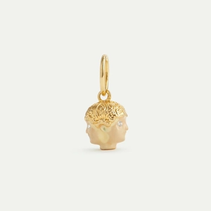 Detail of double-sided gold-plated portrait pendant with enamel face and zircon eyes