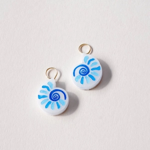 Detailed view of hand-painted shell-shaped pendants with 18K gold plated ring