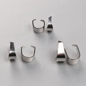 Macro shot of silver stainless steel pinch bails for pendant DIY jewelry making