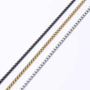 Detailed view of square box chains in black, gold, and silver stainless steel finishes