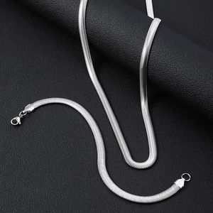 Macro shot of polished silver flat snake chain with a secure lobster claw clasp