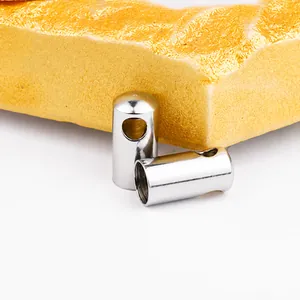 Macro view of polished silver metal cylinder clasp for leather cords and DIY jewelry