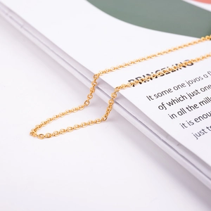 Detailed close-up of a golden cross chain for DIY jewelry making and necklace crafts
