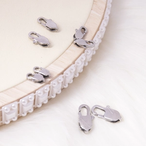 Close-up of stainless steel lobster clasps with brushed texture for DIY jewelry making