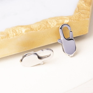 Detailed close-up of polished silver lobster clasps for DIY jewelry making and crafts