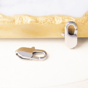 Close-up of polished silver stainless steel lobster clasps for DIY jewelry making