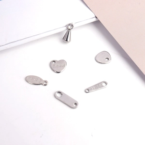 Polished stainless steel charms in heart and oval shapes for DIY jewelry making