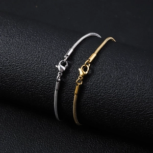 Classic round snake bone chain bracelet in gold and silver finish with lobster clasp