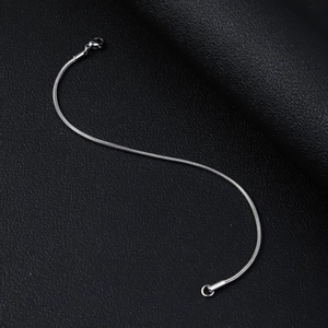 Detailed close-up of a silver stainless steel snake chain with a lobster clasp closure
