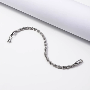 Detailed close-up of a twisted rope chain bracelet with a secure lobster clasp