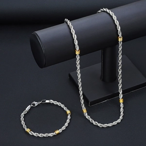 Conjunto de collar y pulsera de acero inoxidable bicolor con cuentas doradas