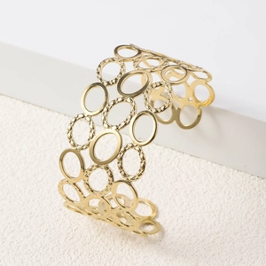 Detailed view of hollow oval rings on 18K gold-plated wide cuff bracelet