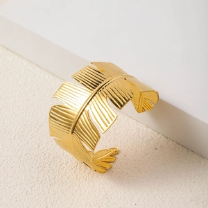 Macro detail of 18K gold plated stainless steel bracelet with banana leaf texture