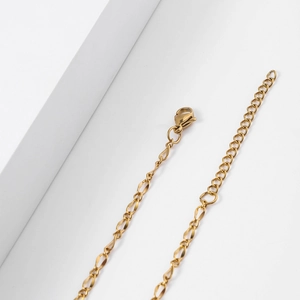 Close-up of 18k gold plated stainless steel lobster clasp and extension chain details